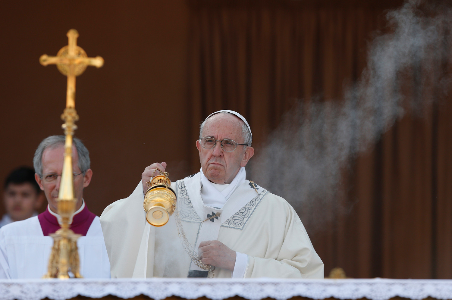 Pope Francis burns incense as he celebrates Mass marking the feast of Corpus Christi in Ostia, a suburb of Rome, June 3.
